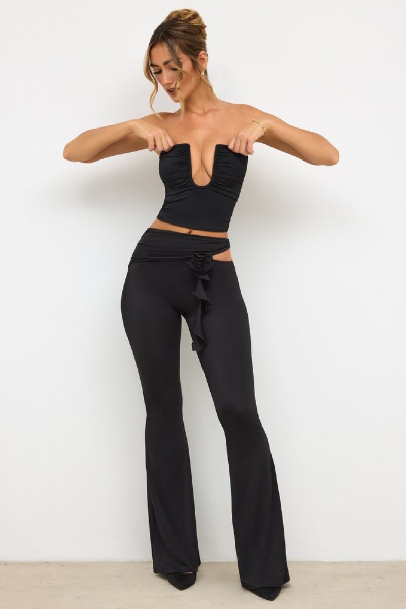 Black Oh Polly Angelika Petite Premium Jersey Rose Detail Mid-Rise Flare Trousers | SDPK-83596