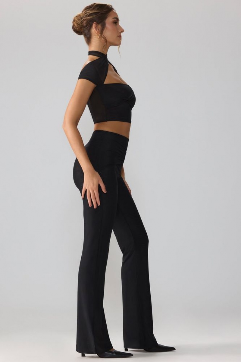 Black Oh Polly Ridley Petite Mesh Mid Rise Twist Overlay Flare Trousers | BRSA-50283