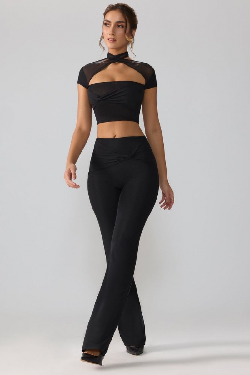 Black Oh Polly Ridley Petite Mesh Mid Rise Twist Overlay Flare Trousers | BRSA-50283